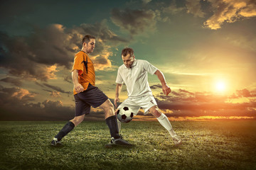 Soccer player with ball in action outdoors.