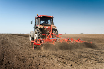 Wall Mural - Tractor preparing land