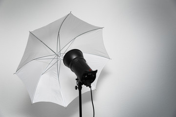 photo studio lightning - strobe flash with white umbrella