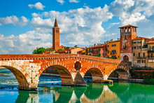 Panoramic View To Bridge Ponte Pietra In Verona On Adige River.