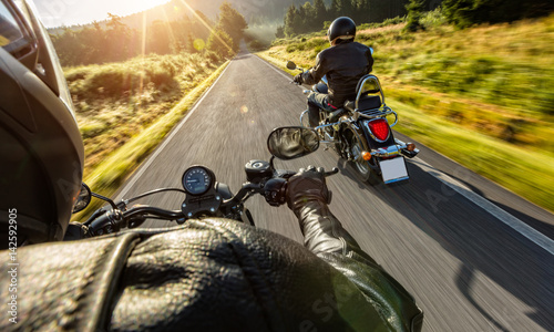 Fotografía Two motorbikers riding on empty road
