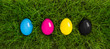 cmyk easter eggs lying in grass
