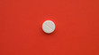 Meds pills drugs lsd extasy acid red background. Positive medicine concept. Treatment of various disease.
