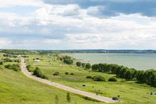 Romantic Road Into The Distance, Horizon, Lake And Green Flat Plain. Sports And Recreation In Auto Kemping On Plesheevo Lake Resort.