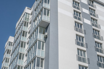 new multistory residential building in the background