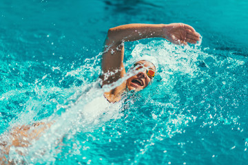 Wall Mural - Female swimmer on training in the swimming pool