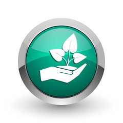 Fototapete - Hand protect plant growth silver metallic chrome web design green round internet icon with shadow on white background.
