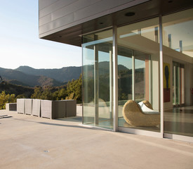 External view of a contemporary house with pool at dusk