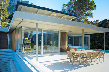 External view of a contemporary house with pool at dusk