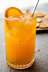 Wall Mural - Orange Cocktail with ice cubes