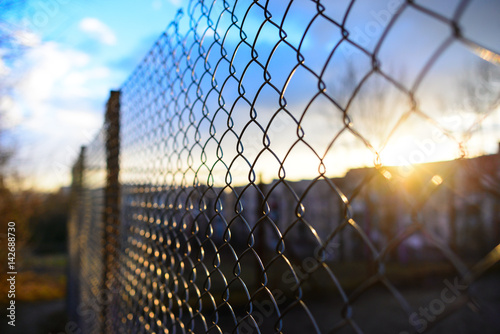 Photographie fence with metal grid in perspective
