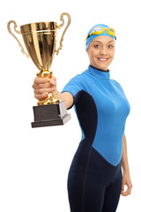 Poster - Joyful female swimmer holding a gold trophy