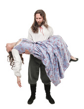 Handsome Man In Medieval Costume Holding Beautiful Woman On His Hands