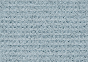 Light blue texture of porous spongy material close-up