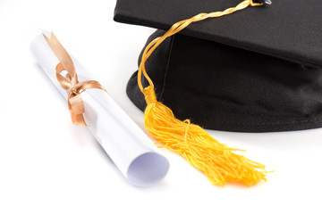 Wall Mural - Close-up view of graduation mortarboard and diploma on white, education concept