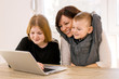 © bnenin - Mother and children web surfing at home