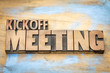 Kickoff meeting word abstract in wood type