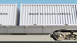 Cargo train and containers with MADE IN SOUTH AFRICA caption. Railway transportation. 3D rendering