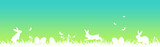 Easter banner with white easter eggs, butterflies, flowers and grass on green and blue gradient background