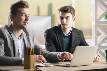 Poster - Males using computer and doing paperwork