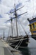 Vintage two masted wooden sailboat moored in the port of St Malo, Brittany, France. Vertical front view