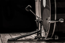 Percussion Instrument, Bass Drum With Pedal On Wooden Boards With A Black Background