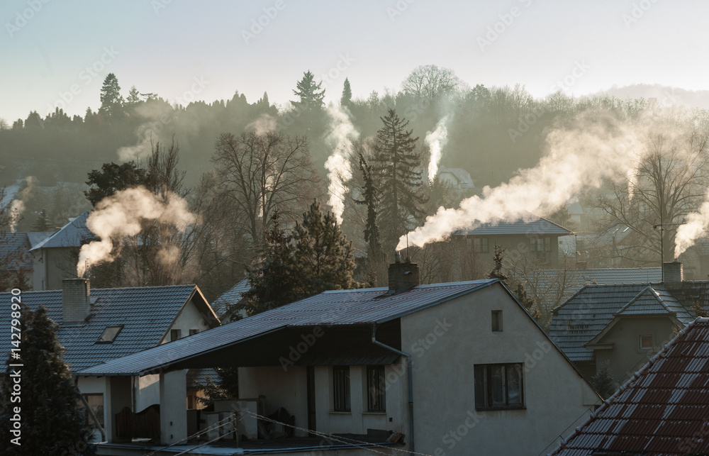 Smoking chimney smoke pollution, small house town in Europe - obrazy, fototapety, plakaty 