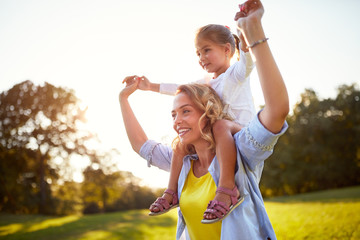 Wall Mural - Mother having fun with daughter outdoor