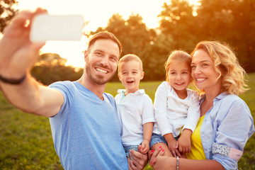 Wall Mural - Male and female with son taking photo