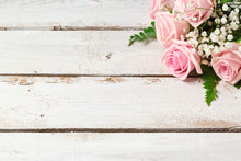 Background With Rose Flowers Bouquet On Wooden Vintage Table