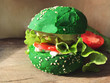 Exotic green burger in bun with sesame seeds tomato lettuce