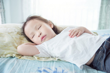 Wall Mural - Little asian girl sleeping in day time