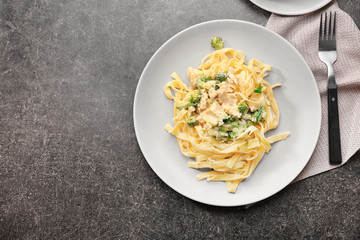 Wall Mural - Plate with delicious Chicken Alfredo on table