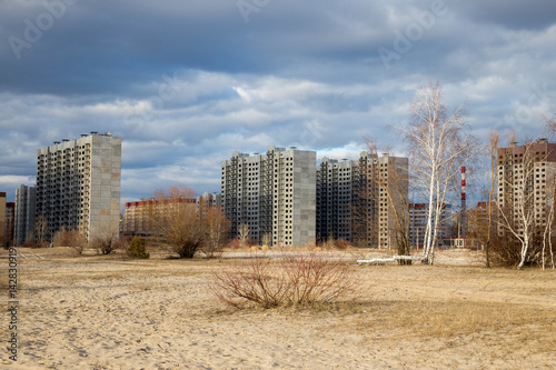 Construction of new multi-storey houses in the vacant lot Poster