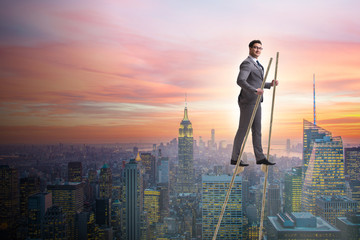 businessman walking on stilts - standing out from the crowd