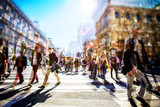 Fototapeta  - Crowd of anonymous people walking on busy city street