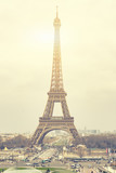 Fototapeta Boho - The Eiffel tower is one of the most recognizable landmarks in the world under sun light,selective focus,vintage color
