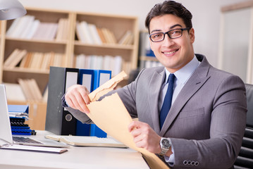 Businessman receiving letter in the office