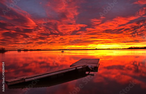 Firery Sunrise over the boat dock
