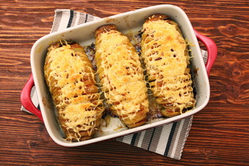 Wall Mural - Sliced baked potatoes with cheese and bacon