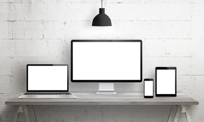 Poster - Responsive web site mockup. Computer display, laptop, tablet and smart phone on desk with isolated, blank, white screen for design presentation.