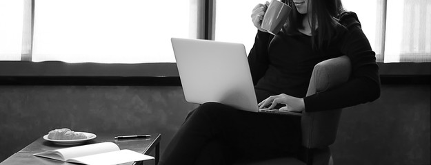 Poster - Young woman having a cup of coffee Business woman with laptop work and chill