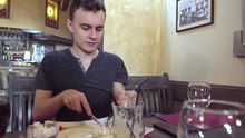 Young Man Having Dinner