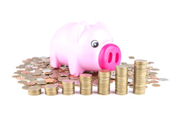 piggy bank over coins stack isolated on white background