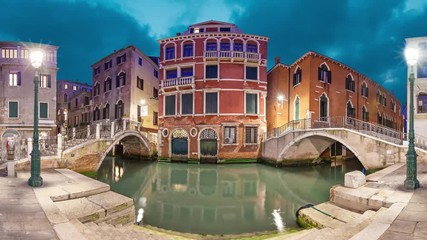 Fototapete - Two bridges and red mansion in the evening on piazza Manin square, Venice, Italy (static image with animated sky and water)
