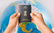 closeup picture of indian man holding indian passport over white background, selective focus