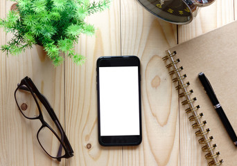 office desk table with blank screen smart phone