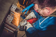 © kerkezz - Worker Using Angle Grinder