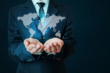 Businessman holding world map.