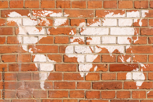 Obraz w ramie Antique brick wall with World map graffiti